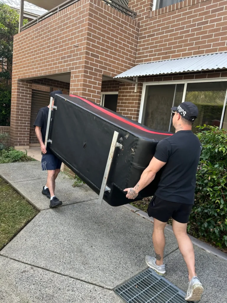 Woy Woy Removalists carrying a sofa
